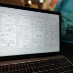 Website wireframe layout on a laptop screen representing sidebar drop error